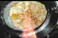 Cooking amritsari kulcha over direct gas flane
