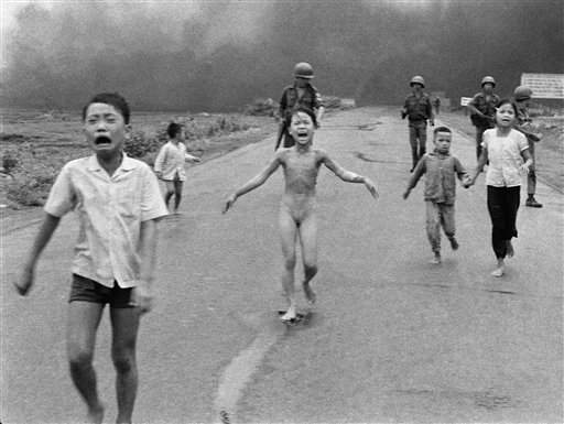 Iconic photo of crying Vietnamese children after an aerial napalm attack near near Trang Bang, Vietnam, June 8, 1972, Photo by Nick Ut / AP.