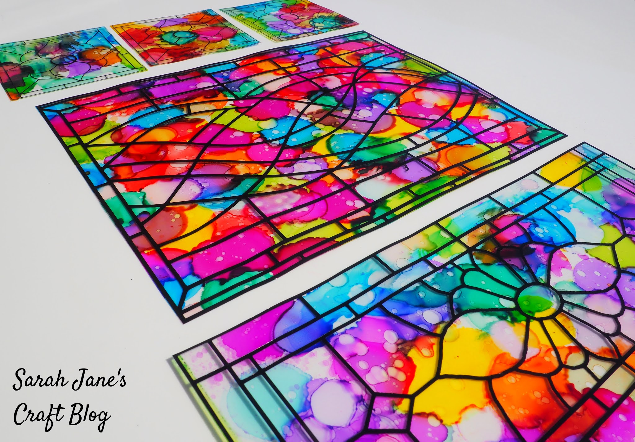 Hanging Faux Stained Glass Panels Made With Laminating Pouches Alcohol Ink And Vinyl Decals