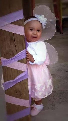 Brooklyn, who has Ichthyosis, dressed up in fairy wings