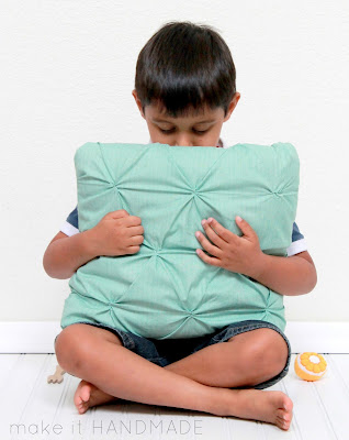 The Twist Pillow-- Free tutorial for a fun smocked throw pillow. | www.makeithandmade.com
