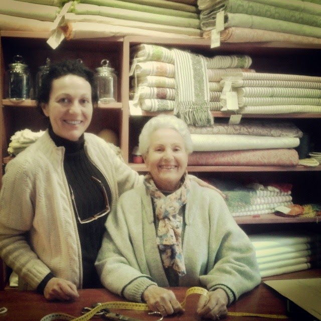 Mother and daughter team inside their tailor shop in Montalcino