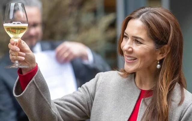 Crown Princess Mary a red contrast-stitch cady dress from Dolce & Gabbana, and double cashmere oslo coat from Joseph