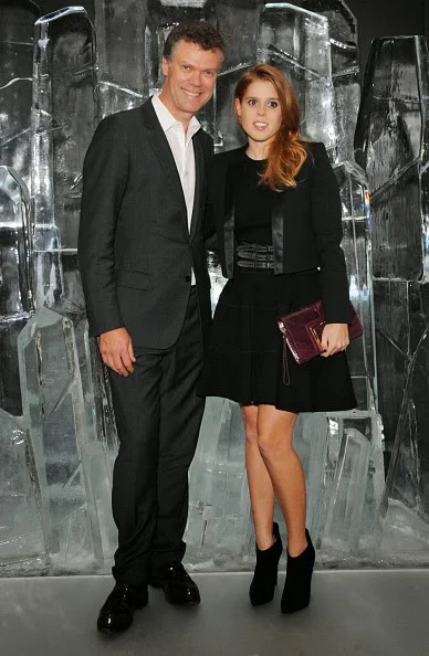 Pierre Denis, CEO of Jimmy Choo, and Princess Beatrice of York attend the dinner hosted by Sandra Choi, Creative Director of Jimmy Choo, to unveil Jimmy Choo's new VICES collection and installation by British artist Mat Collishaw at One Mayfair on 09.10.2014 in London, England. 