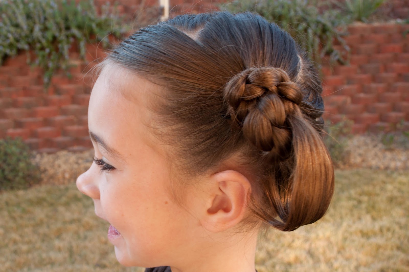 Secure your braid against the heads with a couple bobby pins on each side. 