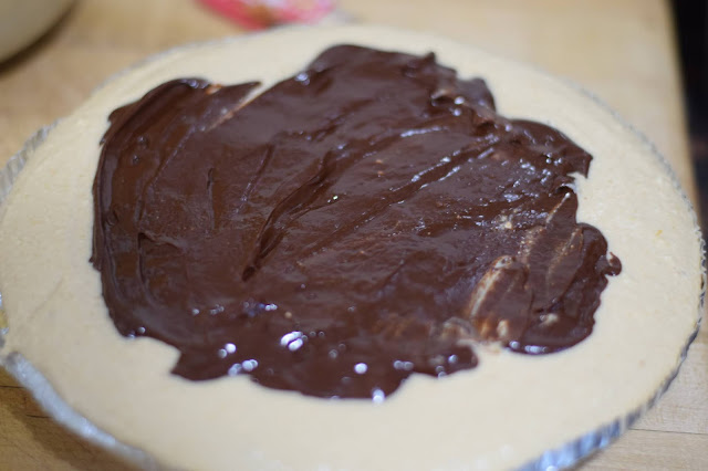 The ganache spread over the top of the pie.