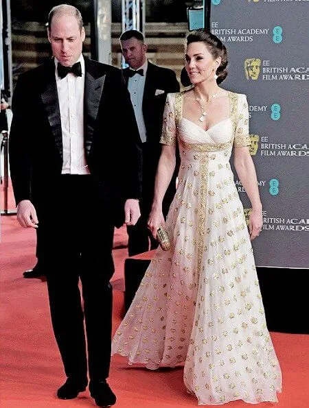 The Duchess wore a gown by Alexander McQueen. Jimmy Choo Romy gold pumps, She carries Anya Hindmarch gold glitter box clutch