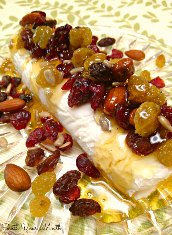 An easy appetizer recipe of goat cheese (or cream cheese), honey and dried fruit and nuts perfect to serve with crackers. This will become one of your go-to appetizers.