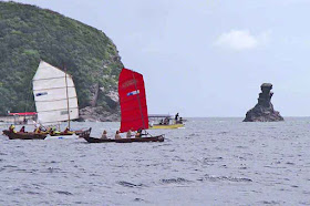 sailing sabani, rock uotcropping, ocean, sky, safety boat