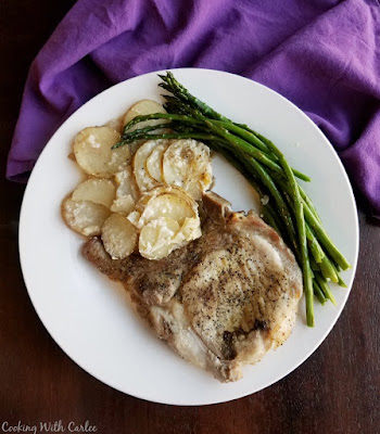 Celebrate national pork month with a plethora of pork recipes! This collection of delicious pork recipes is sure to have your mouth watering. The only question is what to make first! plate with pork chops, scalloped potatoes and asparagus