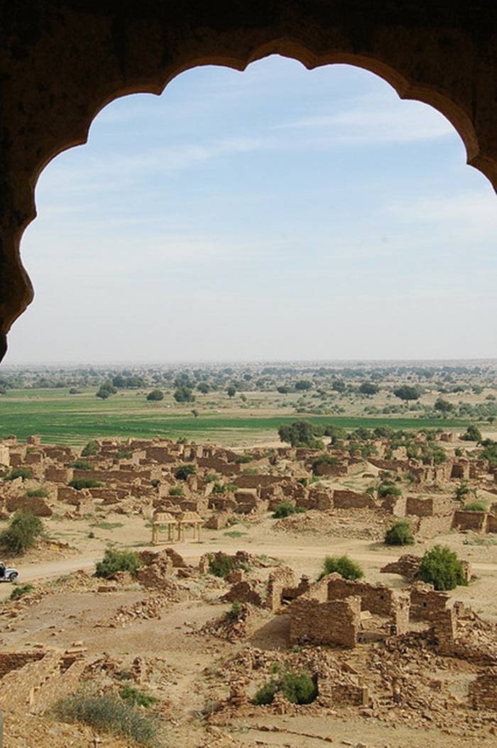 Kuldhara village near Jaisalmer has a very unique history! It is said that the residents of 84 neighboring villages including Kuldhara vacated the villages overnight around 170 years back!! No one is sure where they have gone, but they are believed to have migrated to a place somewhere near Jodhpur. The residents were Paliwal Brahmans — said to be very intelligent, and residing there for about 500 years. So what made them do such an act? Stories say that the ruler of these villages pounded the Paliwals with heavy taxes and treated them very inhumanly; the ruler was unethical and forceful to them. They had no alternative, but to vacate all the 84 villages overnight and just disappear from the vision and reach of the ruler.  When the Paliwals left the villages, they left a curse that nobody can inhabit the villages ever. Residents of Jaisalmer say that there have been some attempts by some families to stay there, but they did not succeed.