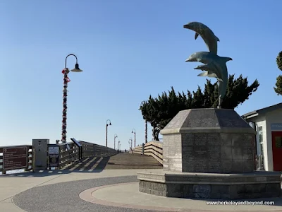 dolphin statue at pier entrance in Cayucos, California