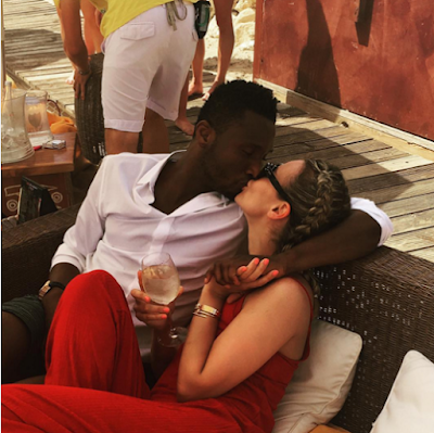p Photo: of Mikel Obi and his partner kiss passionately as they holiday in Spain