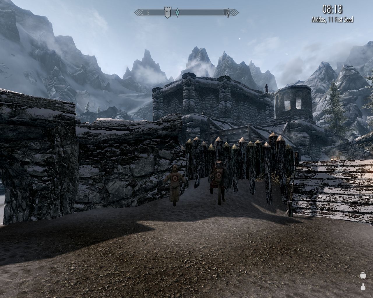 fortress cortyard, training dummies next to stone and wood fortifications, mountains ahead, few clouds in sky