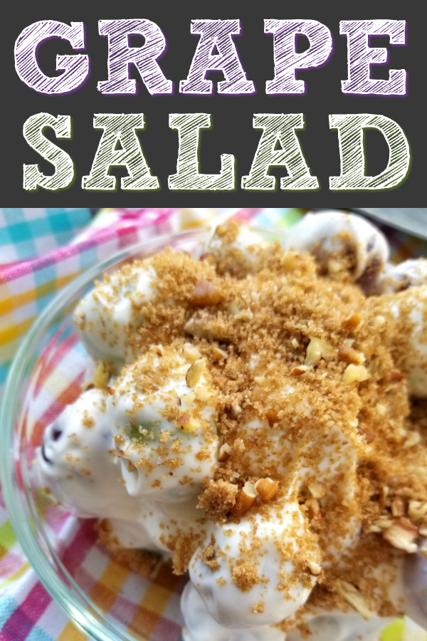 A sweet salad recipe of green and red grapes dressed in a sweet silky cream cheese and sour cream mixture sprinkled with a brown sugar pecan topping. #grapesalad