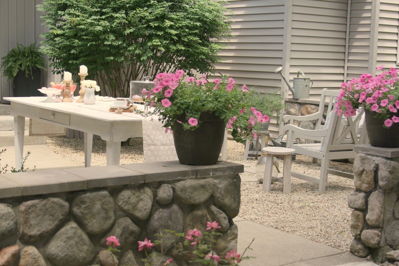 White farm table set with cupcakes and cocktails - Hello Lovely Studio