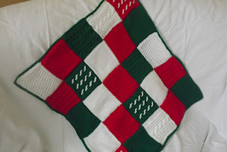 http://www.craftsy.com/pattern/knitting/accessory/a-christmas-cable-and-lace-blanket-/164199