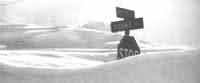 Blizzard of 77 stop sign buried in snow