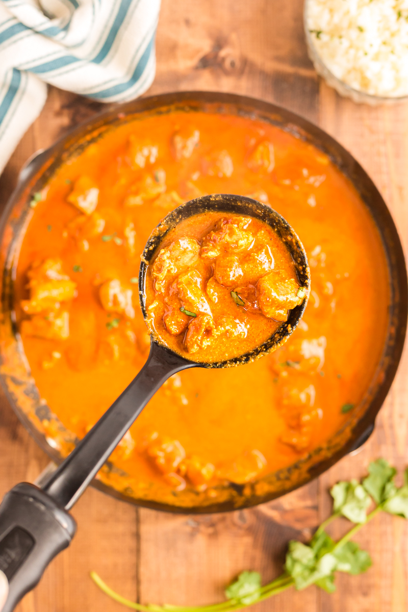 Tender chicken pieces enveloped in an aromatic and incredibly creamy curry sauce, this Low Carb Butter Chicken recipe is one of the best you will try!  #keto #lowcarb #glutenfree #indian #curry #chicken | bobbiskozykitchen.com