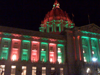 San Francisco City Hall lit in red and green, phone photography by A.E. Graves