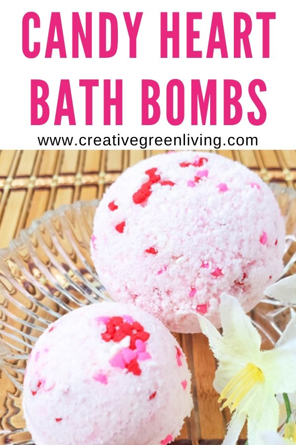 Learn how to make easy DIY bath bombs with essentials oils that smell like candy hearts! These step by step instructions and video makes it simple for beginners to learn how to make bath bombs to give as gifts, keep or to sell. You'll love using natural ingredients like epsom salt to get a Lush quality bath bomb for a lot less money. #creativegreenliving #bathbomb #howtomakebathbombs
