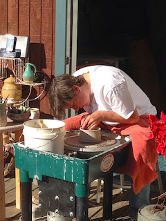 Lori Buff of Future Relics Gallery doing a pottery throwing demonstration 