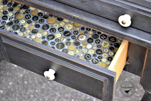 Open drawer with typewriter key lining.