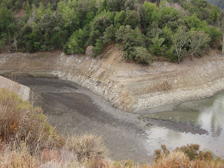 Low water pulling back from an arm of Lexington Reservoir