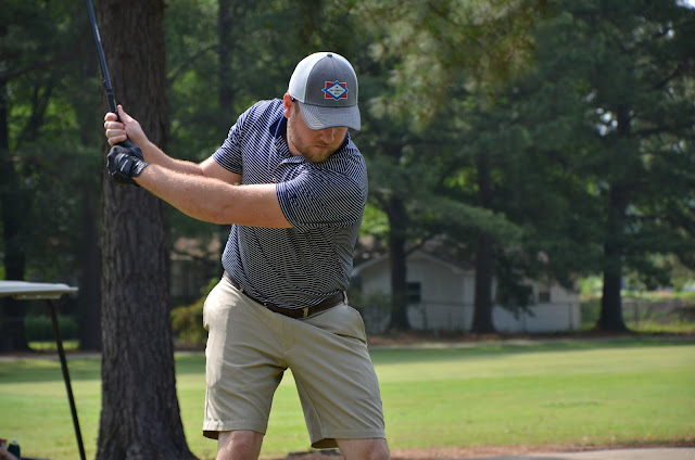 Man swinging a golf club