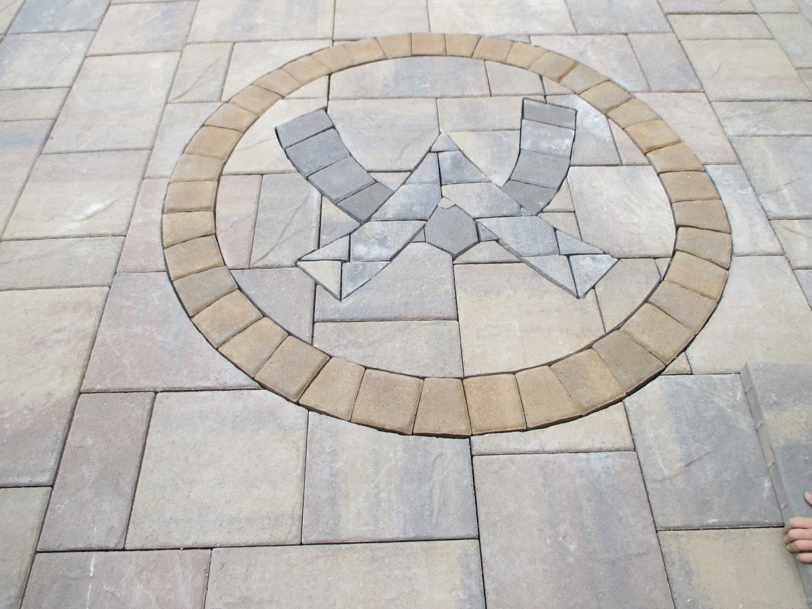 Natures Elite Landscaping Custom Paver Logo in New Hampshire's Lakes