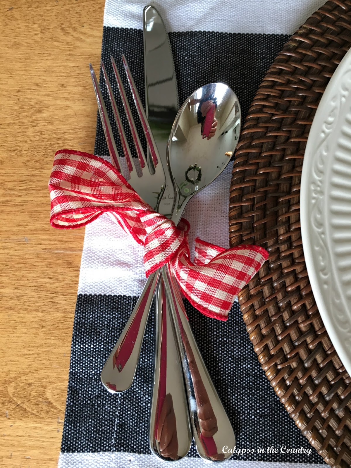 Gingham Ribbon around silverware Red and White Gingham Ribbon around silverware for Christmas