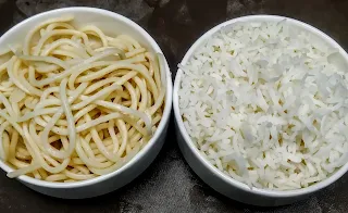 Boiled rice and noodles in bowl for triple schezwan rice recipe