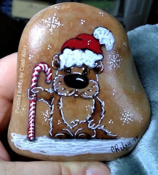 Use this Christmas otter rock painted rock to inspire you to paint your own.