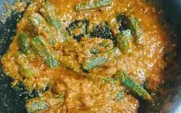 Cooking bhindi with masala