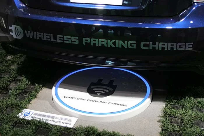electric car wireless charging at parking station