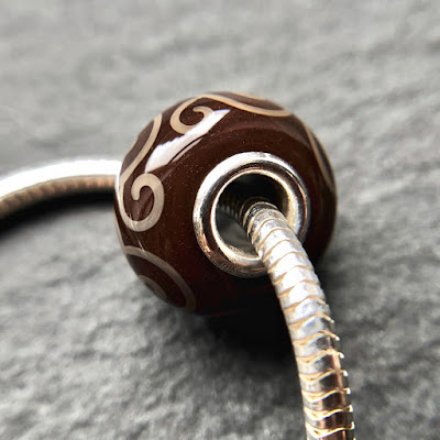 Handmade lampwork silver core big hole charm bead by Laura Sparling made with CiM Chocolate