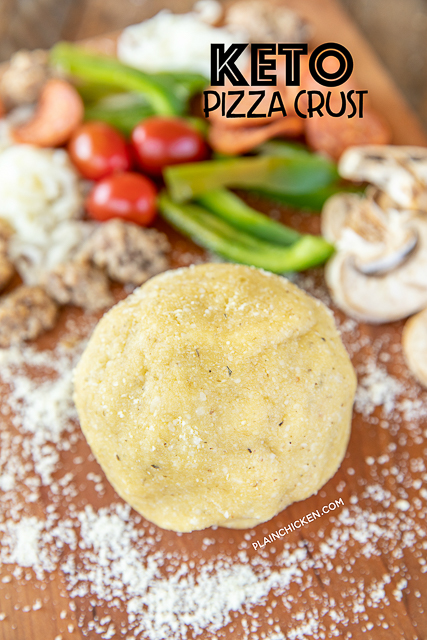 Keto Pizza Crust - a delicious low-carb friendly pizza crust! SO easy to make and tastes great! Almond flour, parmesan cheese, oregano, salt, coconut oil, and an egg. Only takes a minute to make. Top with a sugar-free pizza sauce, mozzarella, and your favorite pizza toppings. Tastes like you are cheating, but you aren't! #pizza #keto #lowcarb #glutenfree ball of keto pizza dough