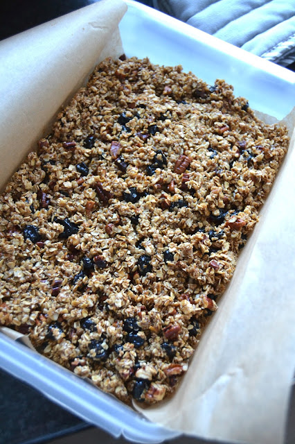Granola bars with oats, maple syrup, coconut oil coconut sugar and dried blueberries.