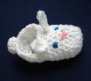 Fuzzy bunny slippers from recycled sweaters and felt details