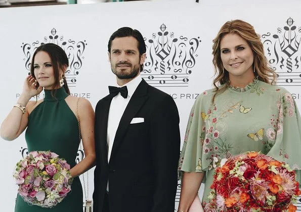 Princess Madeleine wore Giambattista Valli Green Garden Butterfly-print Tiered Silk-georgette Gown. Crown Princess Victoria wore Stylein One Shoulder red gown from Autumn Winter 18 Collection