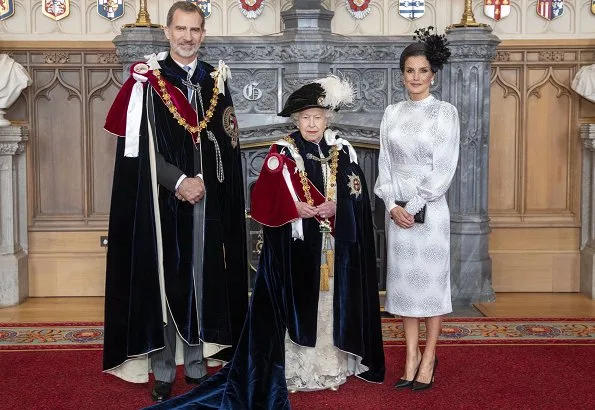 The Duchess is wearing Catherine Walker. Queen Maxima is wearing Claes Iversen. Queen Letizia wore a printed midi dress by Cherubina