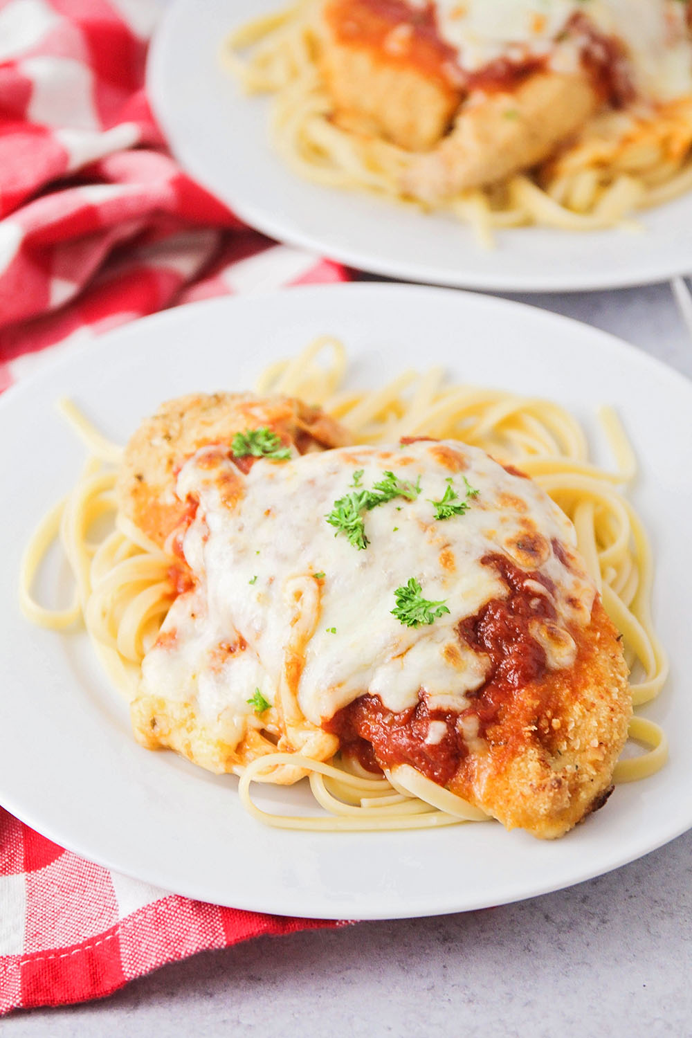 This easy chicken parmesan is a simple and flavorful main dish that's quick to make, and a family favorite!