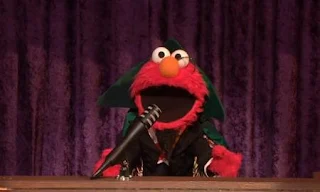 Elmo disguises himself as The Count. Sesame Street Count On Elmo