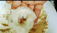 Making doughnut shape with urad dal batter for medu wada recipe