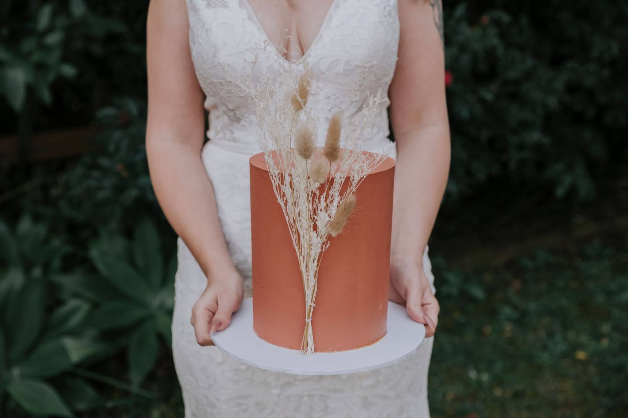 to the aisle australia | luxe bohemian weddings gold coast Atomic Butterfly Photography florals leather couch hat cake venue styling