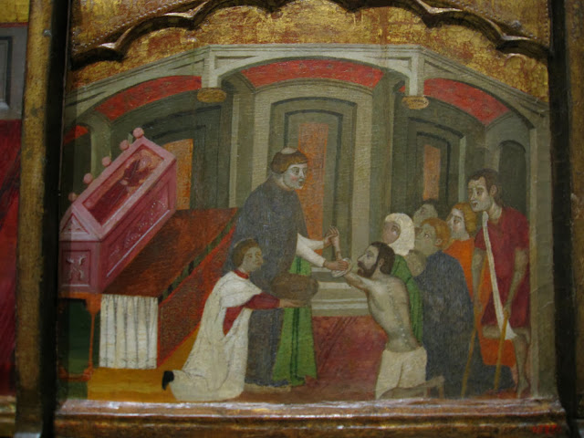 Fragmento del Retablo de San Antonio en el que un fraile antoniano atiende a los enfermos del fuego de San Antonio.