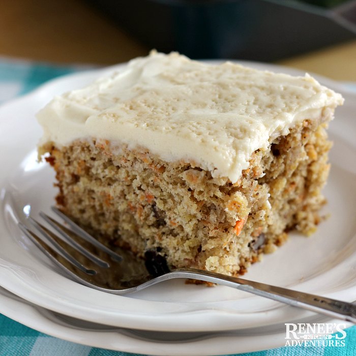 A piece of Healthy Carrot Cake by Renee's Kitchen Adventures on a white plate with a fork