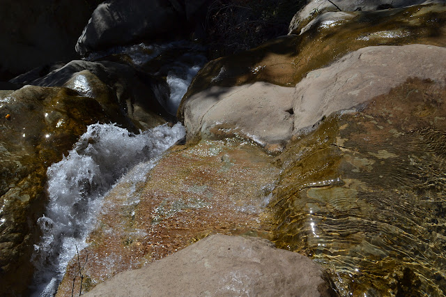 flowing water over smooth stone
