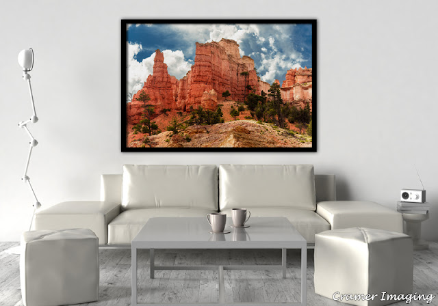 Photograph of Cramer Imaging fine art photograph 'Ancient Red Skyscrapers' on the wall of a living room setting