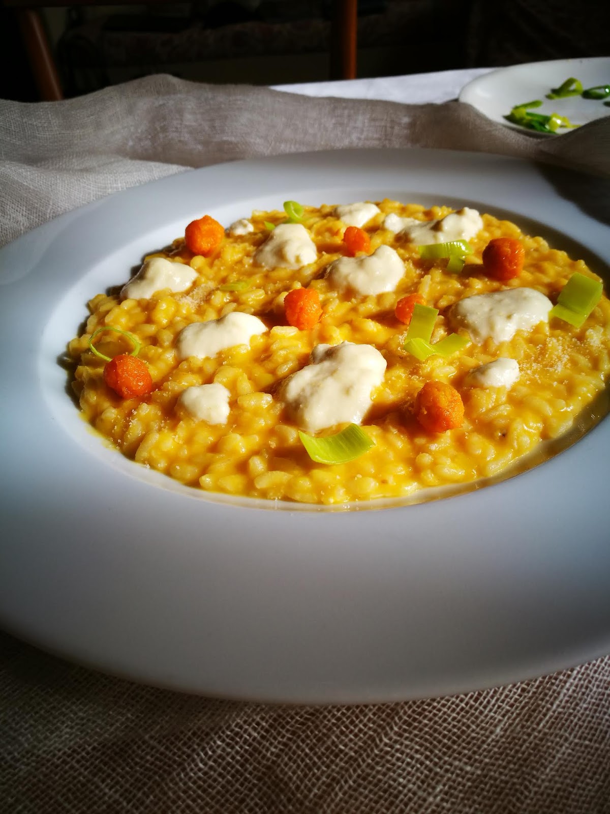 Risotto con la zucca mericana fonduta di formaggio e briciole